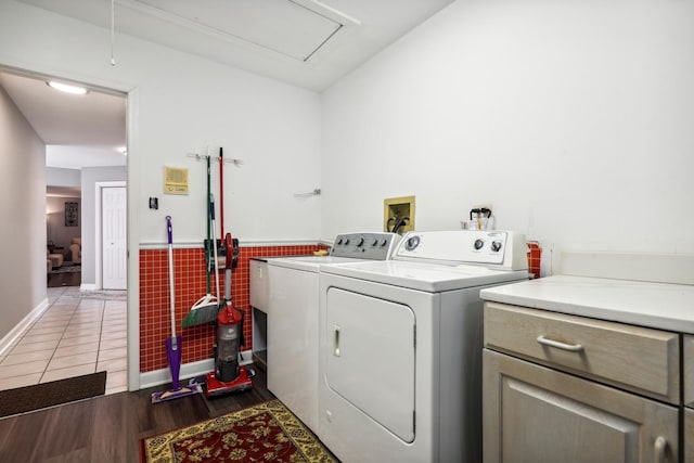 5932 W 75th Pl, Burbank, IL 60459 - laundry room with cabinet space, independent washer and dryer, tile walls, wood finished floors, and a wainscoted wall