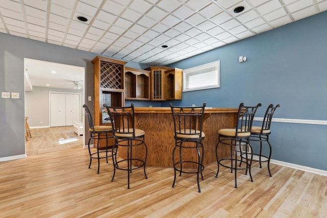 5932 W 75th Pl, Burbank, IL 60459 - indoor dry bar featuring light wood-style flooring and baseboards