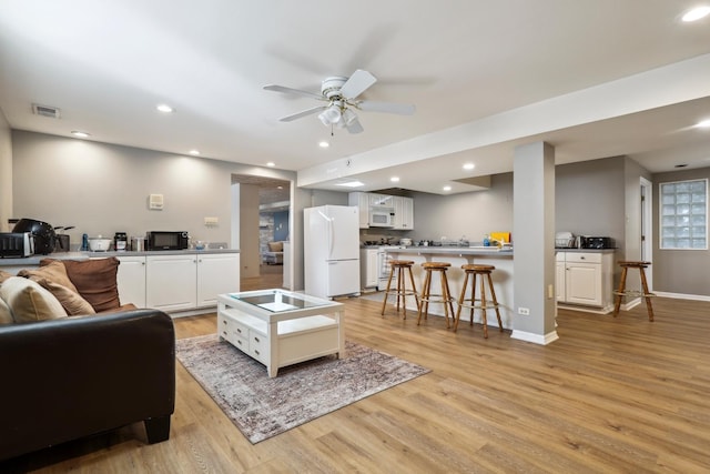 5932 W 75th Pl, Burbank, IL 60459 - living room featuring light wood-type flooring, a ceiling fan, and recessed lighting