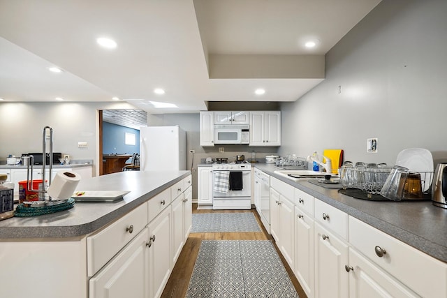 5932 W 75th Pl, Burbank, IL 60459 - kitchen featuring white appliances, dark wood-style floors, white cabinetry, recessed lighting, and dark countertops