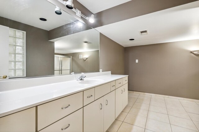 5932 W 75th Pl, Burbank, IL 60459 - full bathroom featuring vanity, tile patterned flooring, and a shower with shower door