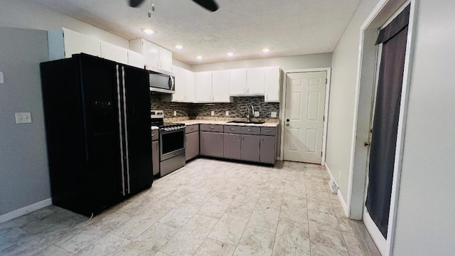 113 E Seminole St, Dwight, IL 60420 - kitchen featuring stainless steel appliances, light countertops, white cabinets, a ceiling fan, and recessed lighting