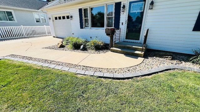 113 E Seminole St, Dwight, IL 60420 - view of exterior entry featuring an attached garage and a yard