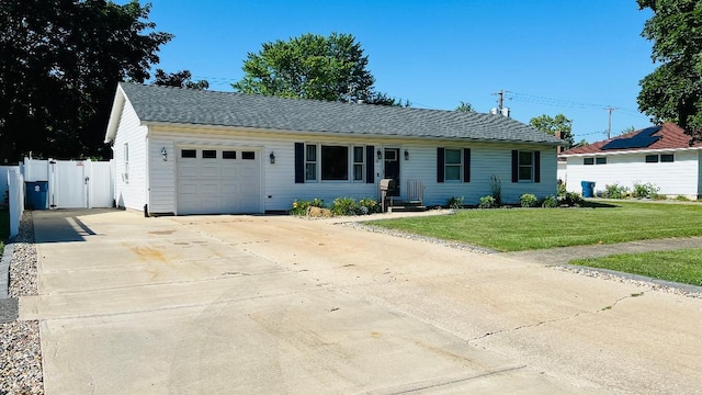 113 E Seminole St, Dwight, IL 60420 - ranch-style house featuring a garage, driveway, and a gate