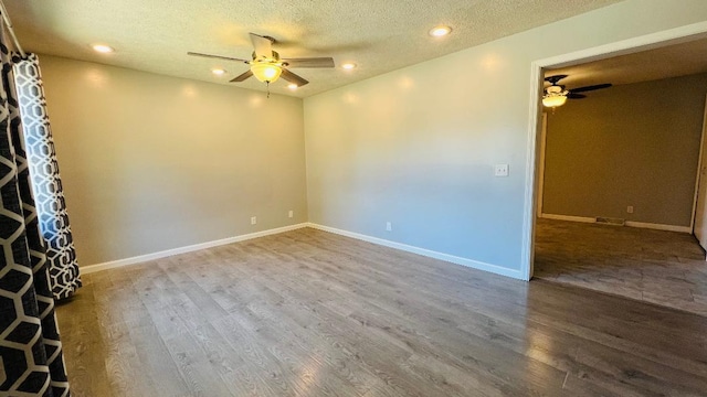 113 E Seminole St, Dwight, IL 60420 - empty room with a ceiling fan, wood finished floors, recessed lighting, and a textured ceiling