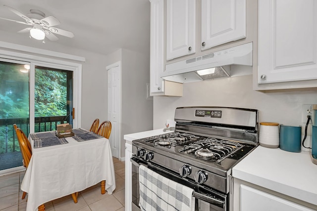 2003 Tall Oaks Dr Unit 2B, Aurora, IL 60505 - kitchen with black gas stove, under cabinet range hood, light countertops, white cabinetry, and light tile patterned floors