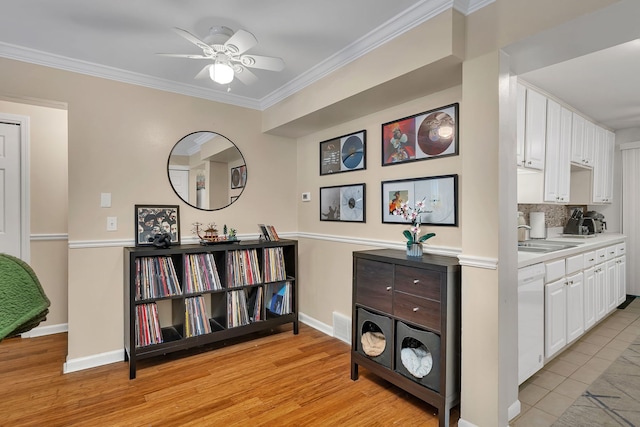 2003 Tall Oaks Dr Unit 2B, Aurora, IL 60505 - kitchen featuring white dishwasher, white cabinets, ornamental molding, light countertops, and a ceiling fan