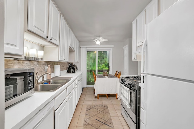 2003 Tall Oaks Dr Unit 2B, Aurora, IL 60505 - kitchen with white appliances, white cabinets, decorative backsplash, and a ceiling fan