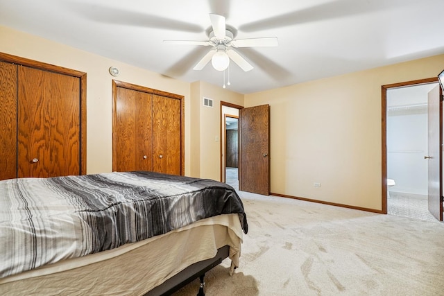 7340 Mimosa Dr, Orland Park, IL 60462 - bedroom featuring light carpet, multiple closets, ensuite bath, and a ceiling fan