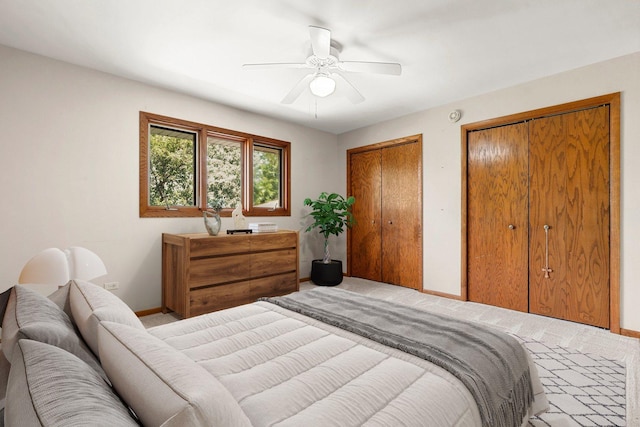 7340 Mimosa Dr, Orland Park, IL 60462 - bedroom featuring carpet, two closets, and ceiling fan