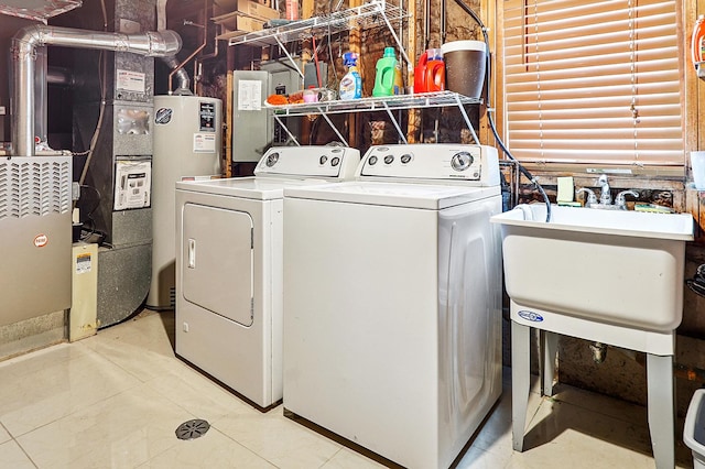 7340 Mimosa Dr, Orland Park, IL 60462 - laundry area featuring washing machine and clothes dryer, water heater, and light tile patterned flooring