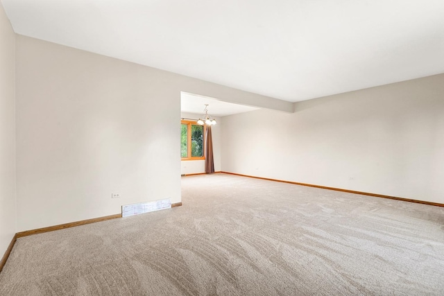 7340 Mimosa Dr, Orland Park, IL 60462 - carpeted spare room featuring baseboards and a chandelier