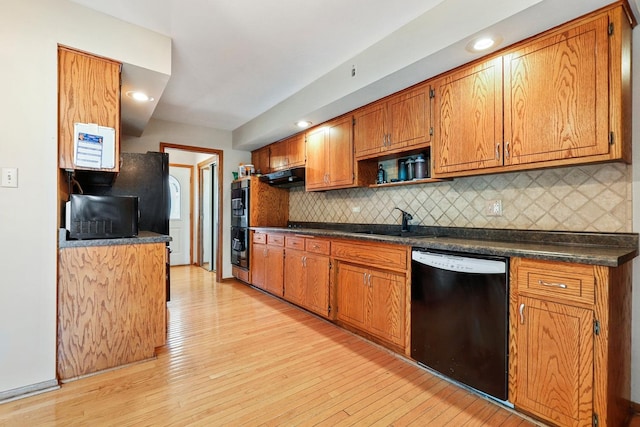 7340 Mimosa Dr, Orland Park, IL 60462 - kitchen with black appliances, dark countertops, under cabinet range hood, backsplash, and recessed lighting