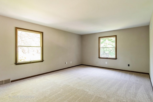 65 Old Post Rd, Montgomery, IL 60538 - unfurnished room with light colored carpet and baseboards