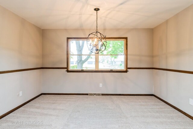 65 Old Post Rd, Montgomery, IL 60538 - carpeted empty room with a chandelier and baseboards