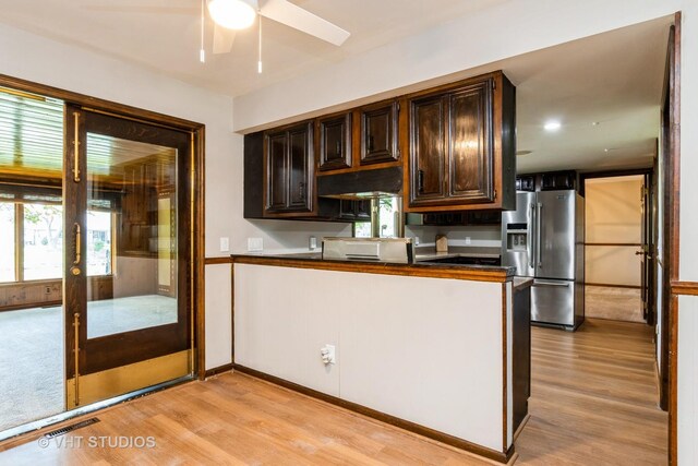 65 Old Post Rd, Montgomery, IL 60538 - kitchen with stainless steel range with electric stovetop, black dishwasher, under cabinet range hood, light wood-type flooring, and dark brown cabinets