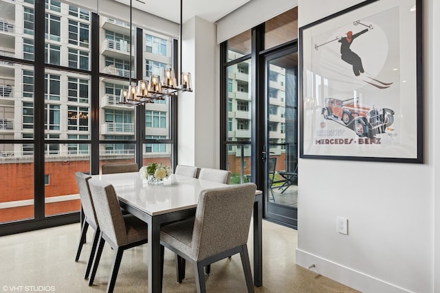 900 W Washington Blvd Unit 404, Chicago, IL 60607 - dining room with a chandelier and expansive windows