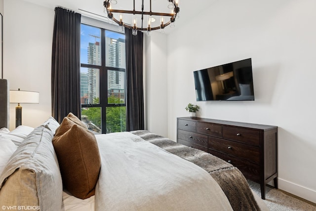 900 W Washington Blvd Unit 404, Chicago, IL 60607 - carpeted bedroom featuring a chandelier and multiple windows