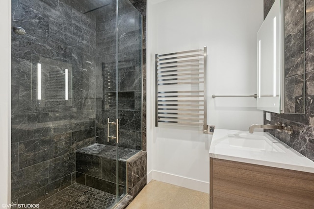 900 W Washington Blvd Unit 404, Chicago, IL 60607 - bathroom featuring radiator heating unit, vanity, a stall shower, and a towel warmer