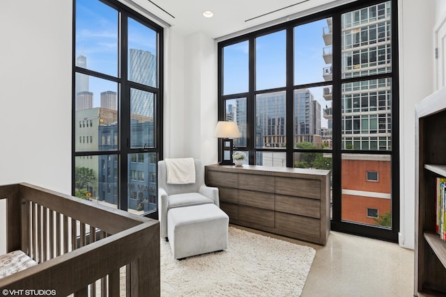 900 W Washington Blvd Unit 404, Chicago, IL 60607 - bedroom with a view of city, floor to ceiling windows, speckled floor, and recessed lighting