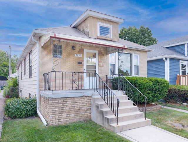 2839 N 75th Ct, Elmwood Park, IL 60707 - view of front facade featuring brick siding and a porch
