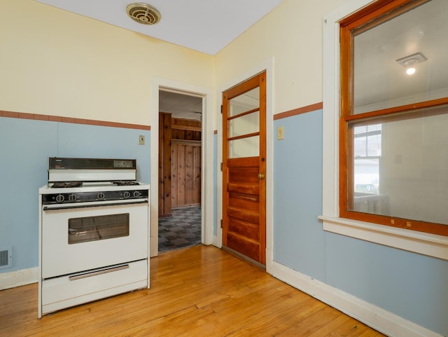 2839 N 75th Ct, Elmwood Park, IL 60707 - kitchen with gas range gas stove and light wood-style floors