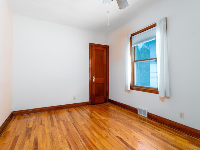 2839 N 75th Ct, Elmwood Park, IL 60707 - unfurnished room featuring light wood finished floors and ceiling fan