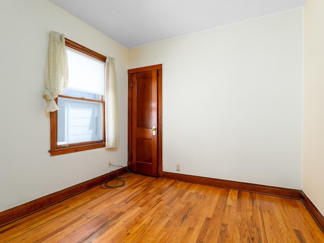 2839 N 75th Ct, Elmwood Park, IL 60707 - unfurnished room featuring baseboards and light wood-type flooring