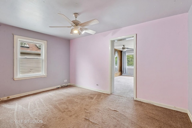 9205 S Utica Ave, Evergreen Park, IL 60805 - carpeted empty room featuring ceiling fan and baseboards