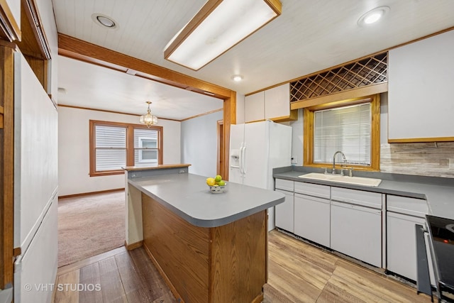 9205 S Utica Ave, Evergreen Park, IL 60805 - kitchen featuring white fridge with ice dispenser, light wood finished floors, a center island, white cabinets, and stove