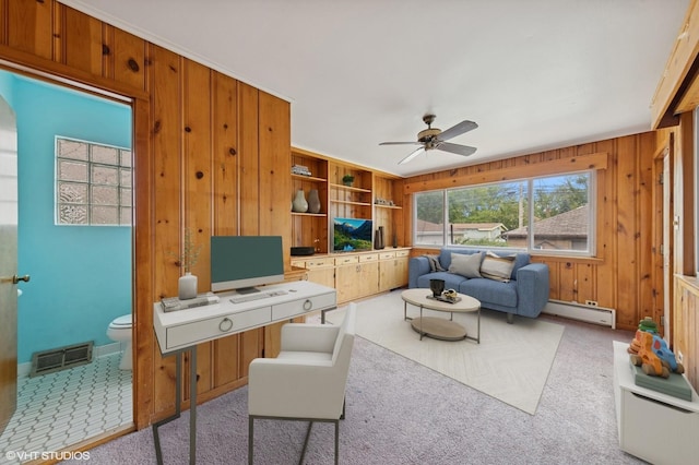 9205 S Utica Ave, Evergreen Park, IL 60805 - carpeted office featuring a baseboard radiator, a ceiling fan, and wood walls