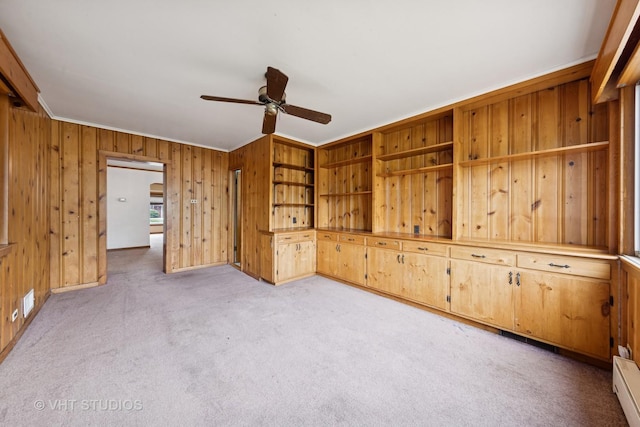 9205 S Utica Ave, Evergreen Park, IL 60805 - unfurnished room featuring ceiling fan, light colored carpet, baseboard heating, wooden walls, and ornamental molding