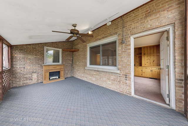 9205 S Utica Ave, Evergreen Park, IL 60805 - unfurnished sunroom featuring vaulted ceiling and track lighting