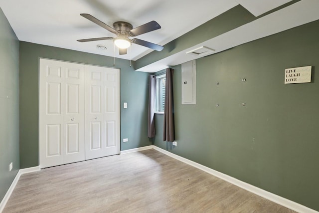 4203 Bunratty Ln, Plainfield, IL 60586 - unfurnished bedroom with light wood finished floors, a closet, ceiling fan, and electric panel
