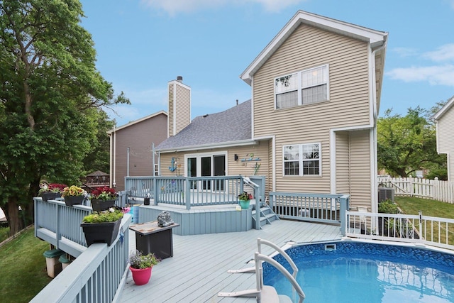 4203 Bunratty Ln, Plainfield, IL 60586 - rear view of property featuring a wooden deck, a chimney, and a shingled roof