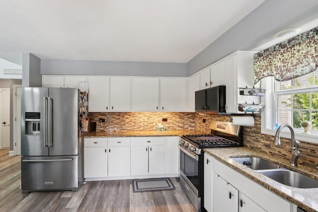 4203 Bunratty Ln, Plainfield, IL 60586 - kitchen featuring stainless steel appliances, wood finished floors, tasteful backsplash, and light stone counters