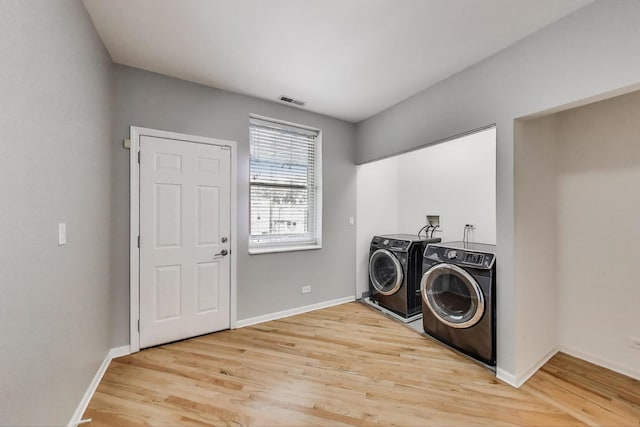 4653 N Lawndale Ave Unit 2S, Chicago, IL 60625 - laundry room featuring separate washer and dryer and light wood finished floors