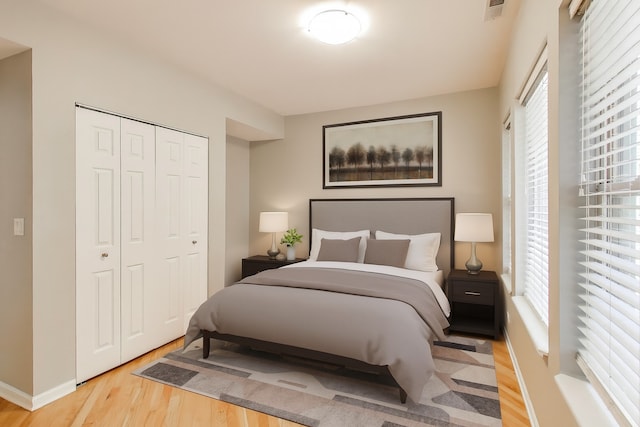 4653 N Lawndale Ave Unit 2S, Chicago, IL 60625 - bedroom with wood finished floors, multiple windows, and a closet