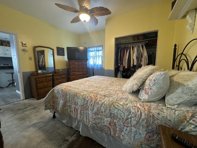 600 W White St, Clinton, IL 61727 - bedroom with a closet, wood finished floors, and a ceiling fan