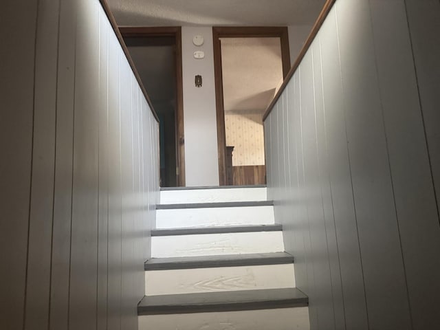 600 W White St, Clinton, IL 61727 - staircase featuring wood walls