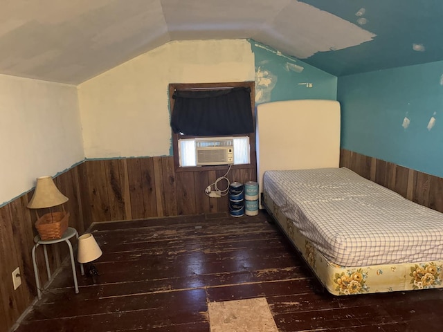 600 W White St, Clinton, IL 61727 - bedroom with hardwood / wood-style floors, wooden walls, a wainscoted wall, lofted ceiling, and cooling unit