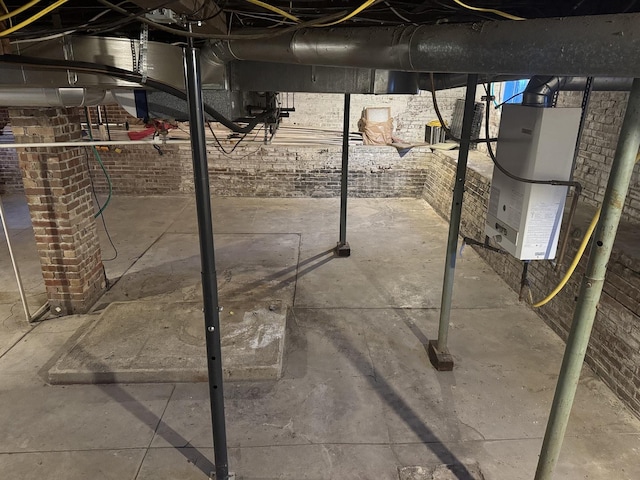 600 W White St, Clinton, IL 61727 - unfinished below grade area with heating unit