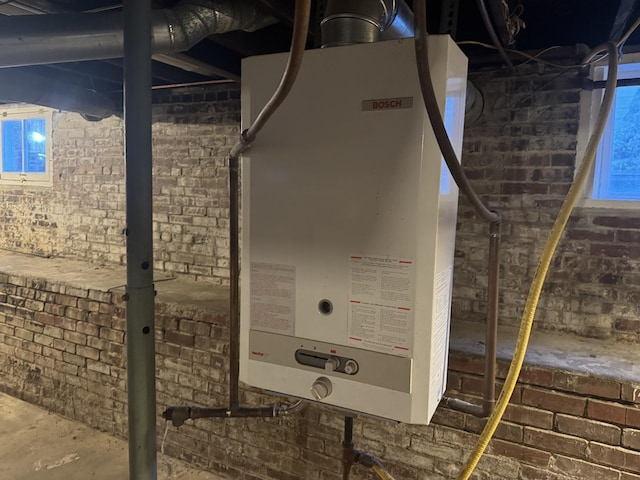 600 W White St, Clinton, IL 61727 - basement view of tankless water heater and brick wall