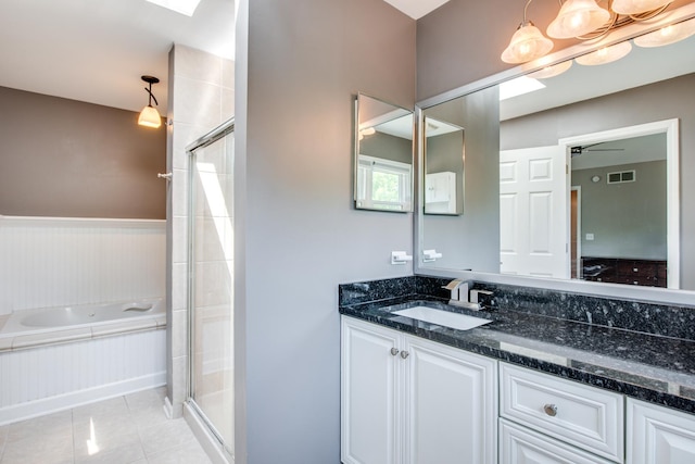 1818 Olde Mill Rd, Plainfield, IL 60586 - bathroom featuring a bath, vanity, a shower stall, tile patterned flooring, and wainscoting
