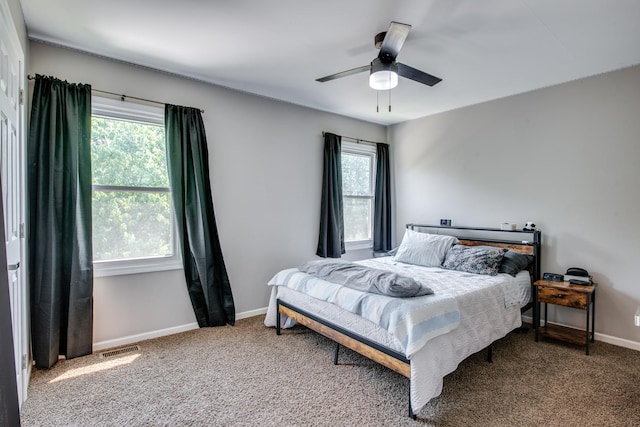 1818 Olde Mill Rd, Plainfield, IL 60586 - carpeted bedroom with baseboards and a ceiling fan