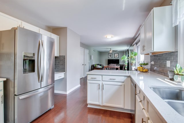 1818 Olde Mill Rd, Plainfield, IL 60586 - kitchen featuring stainless steel appliances, a peninsula, backsplash, and dark wood finished floors