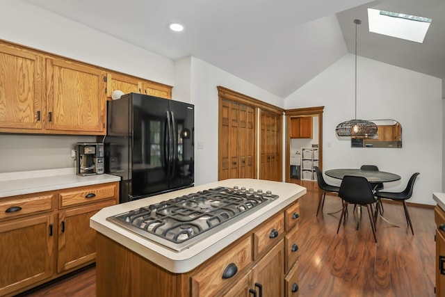 1091 Danforth Dr, Batavia, IL 60510 - kitchen featuring freestanding refrigerator, a skylight, stainless steel gas stovetop, light countertops, and lofted ceiling