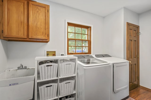 1091 Danforth Dr, Batavia, IL 60510 - laundry area featuring cabinet space, washing machine and dryer, and wood finished floors