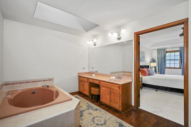 1091 Danforth Dr, Batavia, IL 60510 - ensuite bathroom featuring double vanity, a garden tub, and wood finished floors