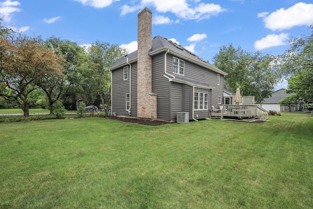 1091 Danforth Dr, Batavia, IL 60510 - back of property featuring a chimney, a yard, and a wooden deck